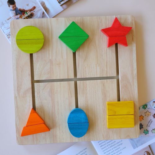 v59 336 202602031611 00.jpg Wooden puzzle with colourful shapes on display.