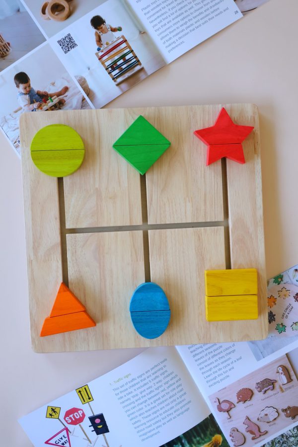 v59 336 202602031611 00.jpg Wooden puzzle with colourful shapes on display.