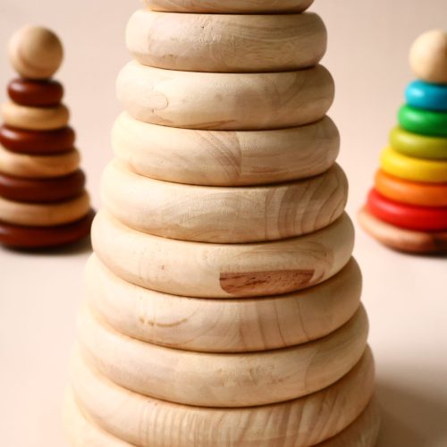 v59 624 202602031611 00.jpg Wooden stacking toys on beige background.