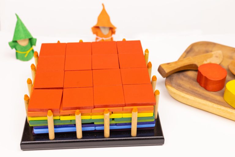 Colourful Montessori blocks and wooden toys on table.