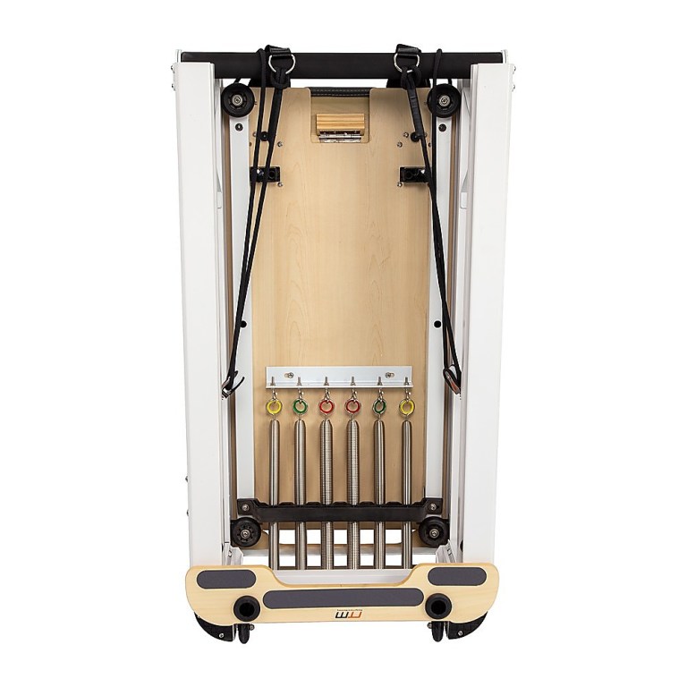 Foldable Pilates reformer with springs and straps.