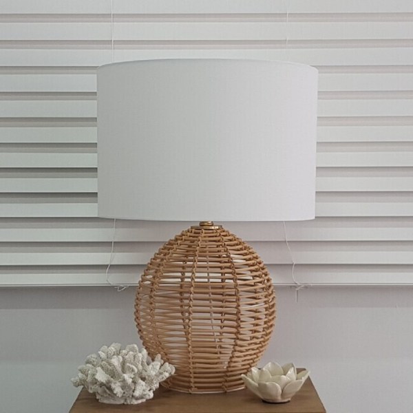 v637 26002 202508251245 00.jpg Wicker lamp with coral and lotus decor items.