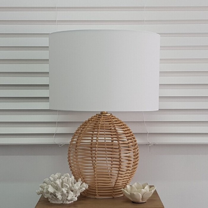 v637 26002 202508251245 00.jpg Wicker lamp with coral and lotus decor items.