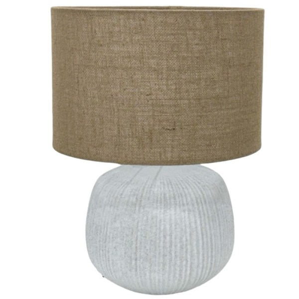 Beige, textured lamp with fabric shade.