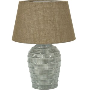 Textured ceramic table lamp with brown fabric shade.