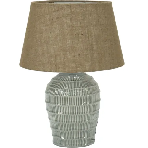 Textured ceramic table lamp with brown fabric shade.
