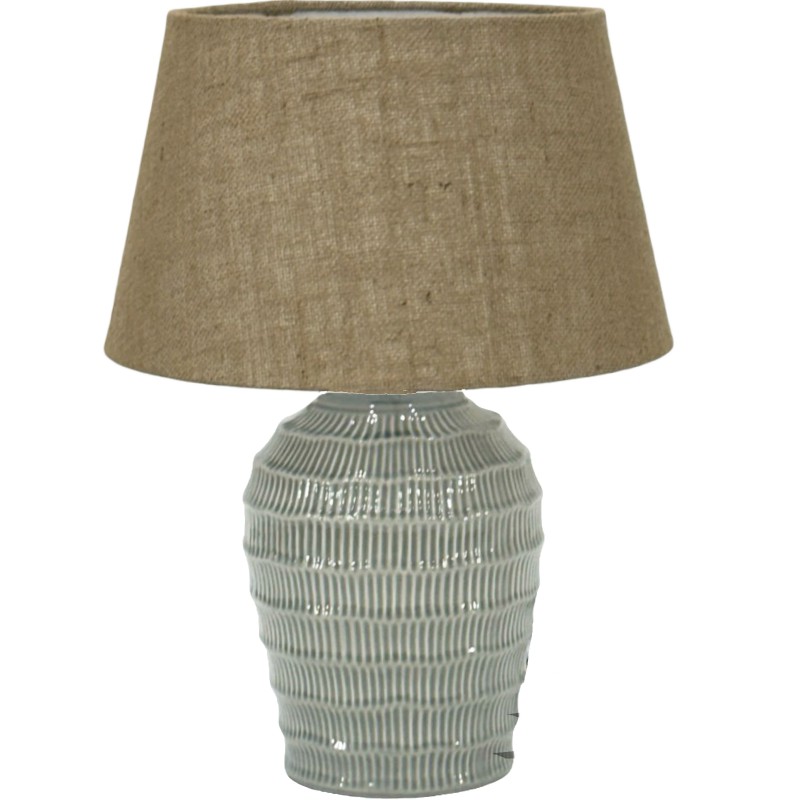 Textured ceramic table lamp with brown fabric shade.