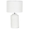 White ceramic table lamp with textured base.