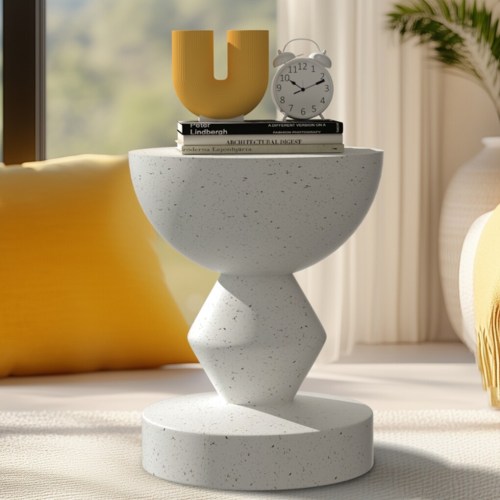 Modern table with clock and books in sunlight.