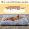 Dog sleeping on comfy grey bed for better posture.