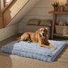 plush pet bed with non slip base and removable cover Golden retriever on a cosy blue dog bed.