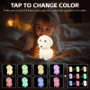 Child with glowing colour-changing dog night light.