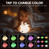Child with colour-changing bunny night light.