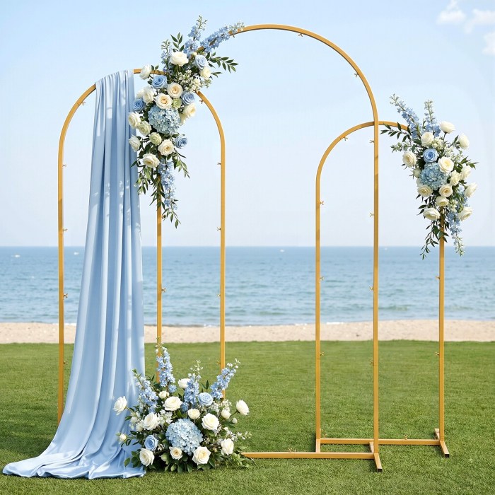 Beach wedding arch with blue flowers and fabric