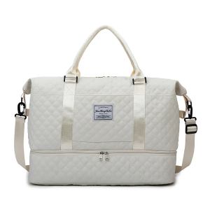 Cream quilted duffle bag with shoulder strap