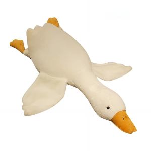 White duck figurine lying on its back