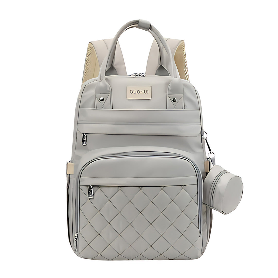 000 a8d492b1 707e 40ca 8e79 97a84376ecba.jpg Light grey quilted backpack with multiple compartments
