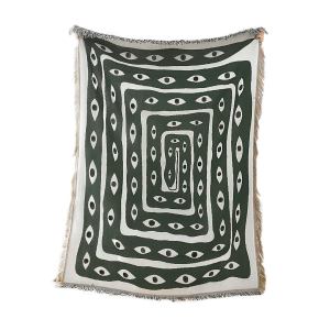 Green throw blanket with eye pattern
