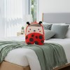 001 Ladybug children’s backpack on neatly made bed