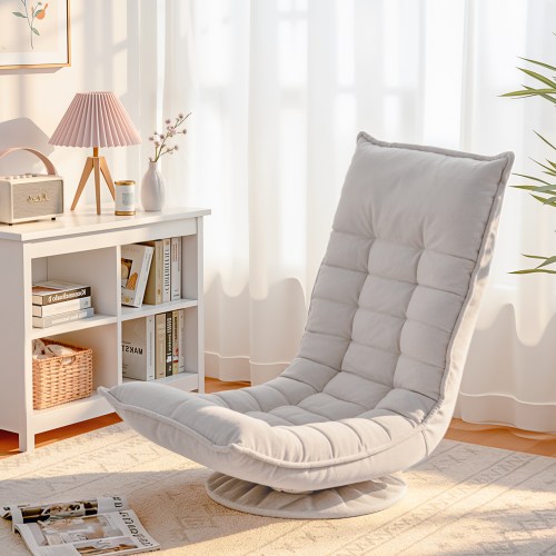 Light grey floor lounge chair by bookshelf