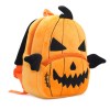 Pumpkin-shaped plush backpack with jack-o'-lantern face