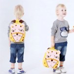 Toddler wearing yellow lion backpack
