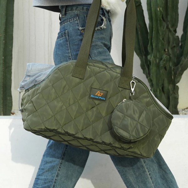 Green quilted duffel bag with shoulder strap