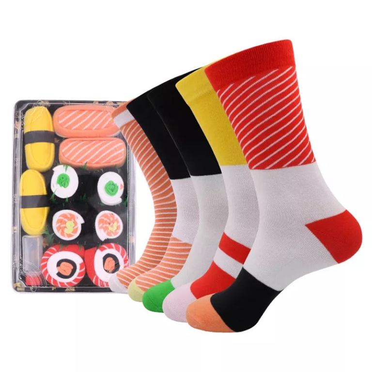 Colourful sushi-themed novelty socks beside sushi set