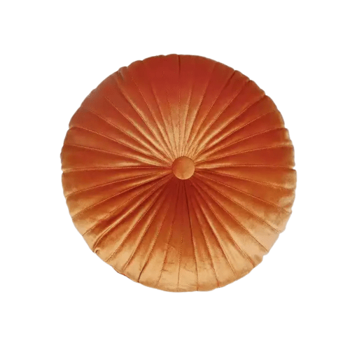 Round pleated orange velvet cushion on white background