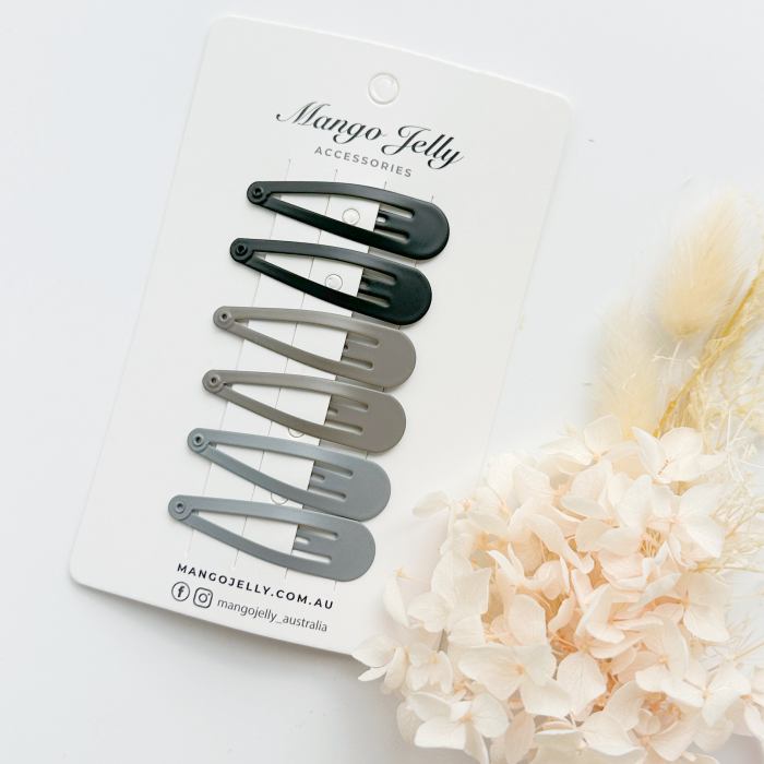 Neutral snap hair clips on display card