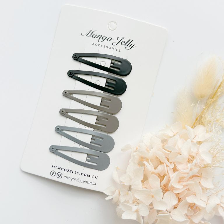Neutral snap hair clips on display card