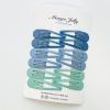 Blue and mint snap hair clips on card