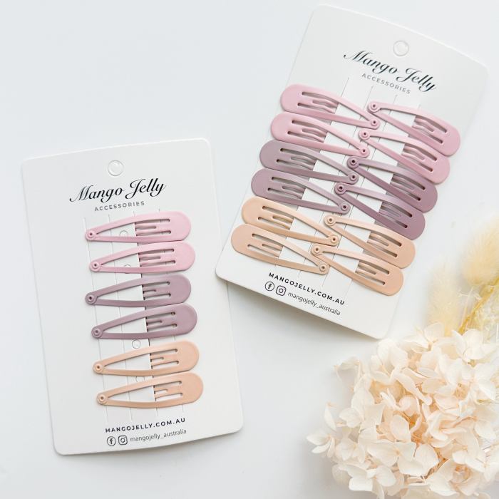 Pastel snap hair clips on display cards