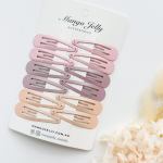 Pastel snap hair clips on display card