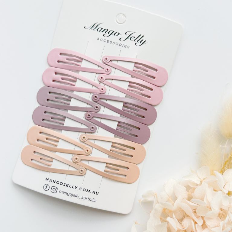 Pastel snap hair clips on display card
