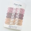 Pastel snap hair clips on display card