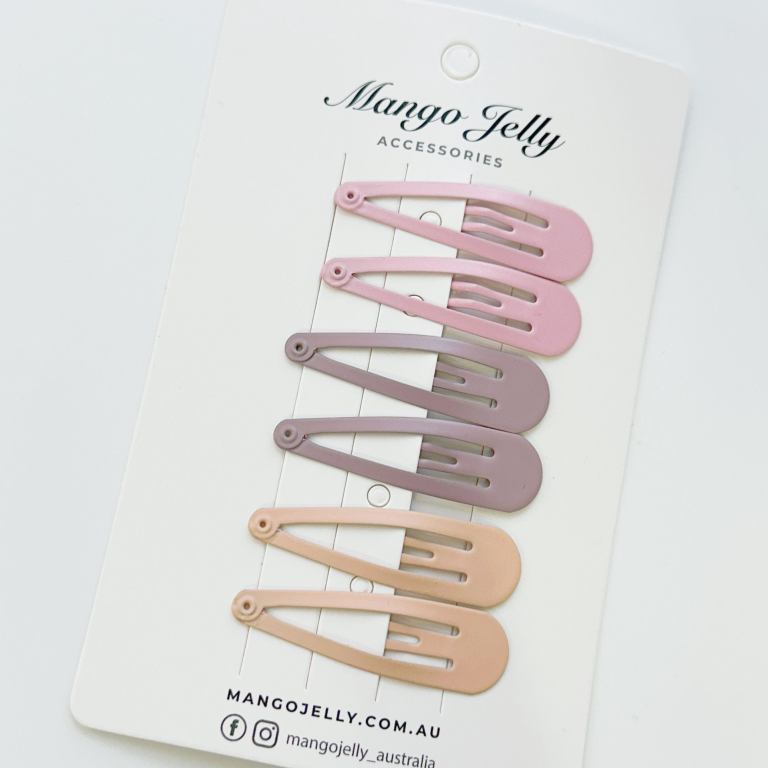 Pastel snap hair clips on display card