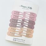 Pastel snap hair clips on branded card