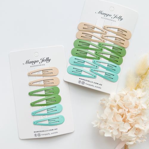Pastel snap hair clips on branded display cards