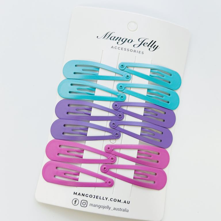 Colourful snap hair clips on display card