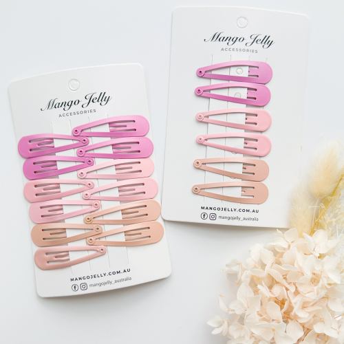 Pink snap hair clips on display cards
