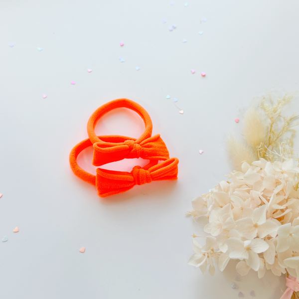 handmade simple bow metal free hair ties neon 1 pairs neon pink Bright orange bow headbands on white background