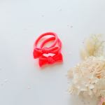 Bright pink bow headbands on white background
