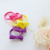 Colourful bow headbands on white background