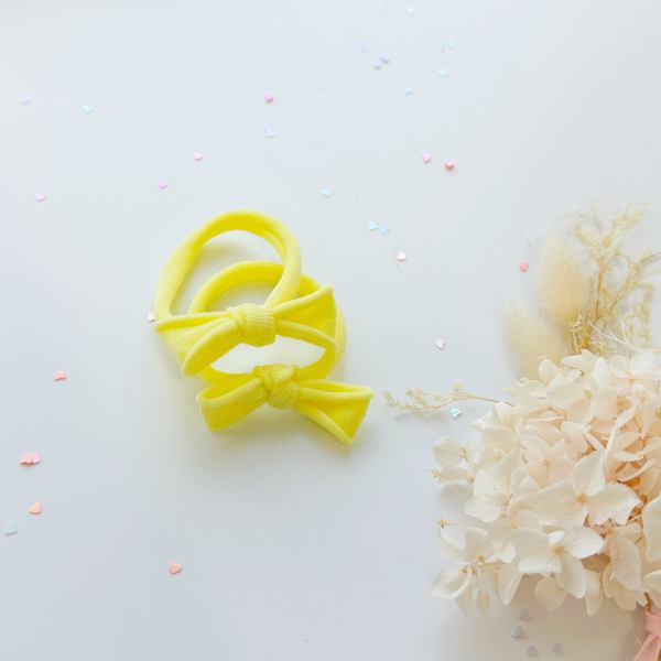 Yellow bow headbands with pastel hearts and flowers