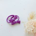 Purple bow hair ties with pastel confetti