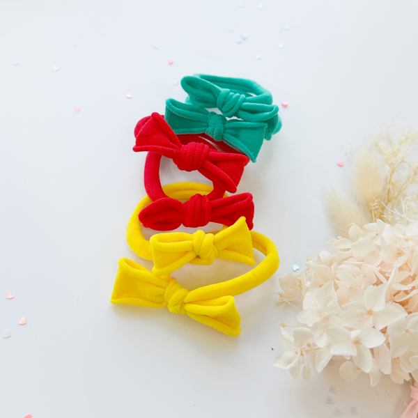 v659 ht metalfree bow 1p yellow 202511101930 00.jpg Colourful bow headbands on white background