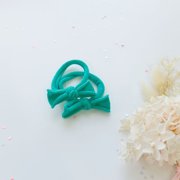 handmade simple bow metal free hair ties pop 1 pairs yellow Teal bow baby headbands on white background