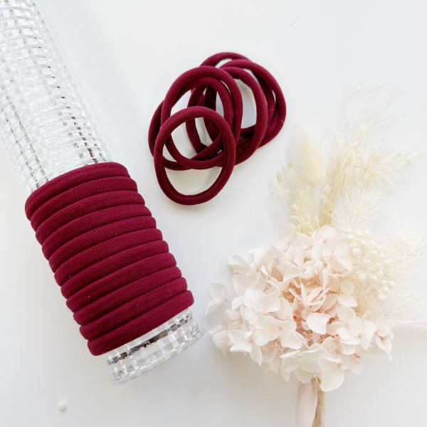 v659 metalfree 4cm 10p sk sk maroon 1 m 160711 00.jpg Maroon elastic hair ties on clear holder