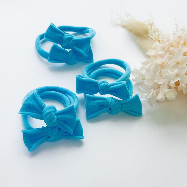 handmade simple bows school colours maroon 1 pairs Turquoise bow hair ties on white surface